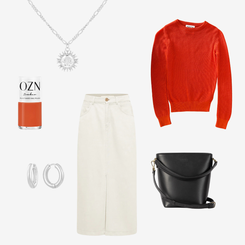 Eine Outfit Inspiration mit Nagellack, Creolen, Handtasche, Rock mit Schlitz, Halskette mit Sonne, Pullover aus Bio Baumwolle. 